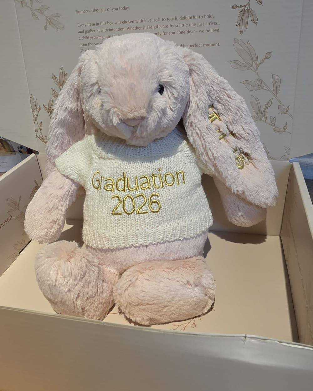 A Jellycat bunny in a sweater embroidered Graduation 2026, packed in a Baby Butter gift box