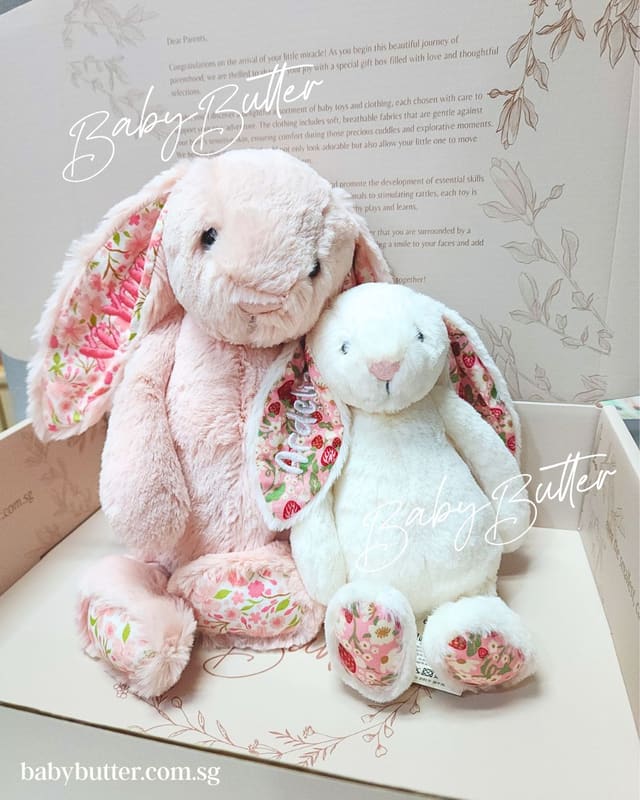 Two personalised Jellycat bunnies, blush and cream, in a Baby Butter gift box