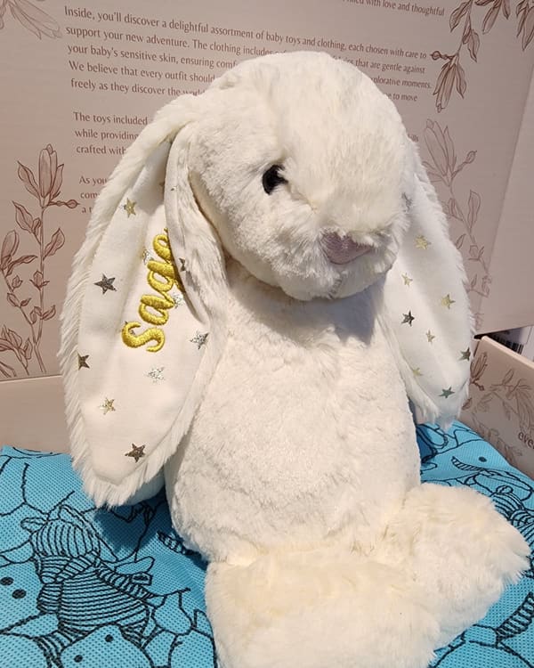 A cream Jellycat bunny with the name Sadie embroidered on its ear